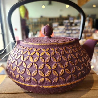 Purple cast iron teapot with gold geometric pattern