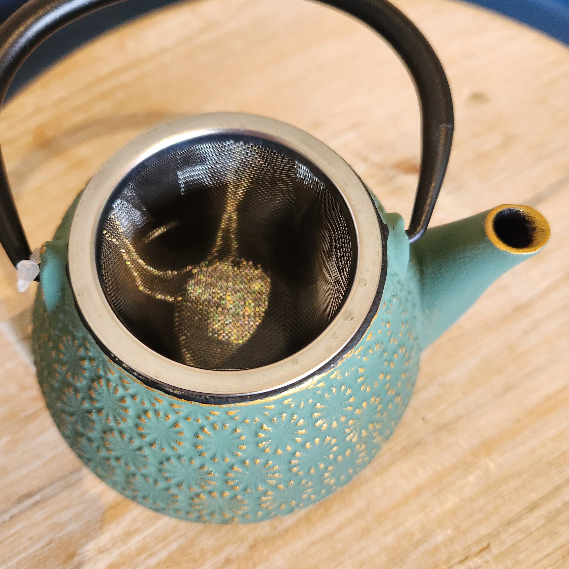 Close up of strainer in the chrysanthemum green teapot