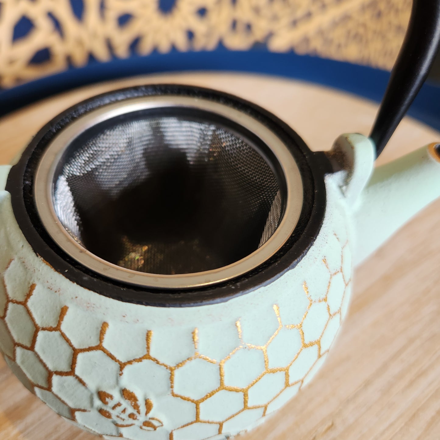 Close up of strainer in honeycomb teapot