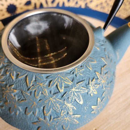 Close up of strainer in turquoise teapot